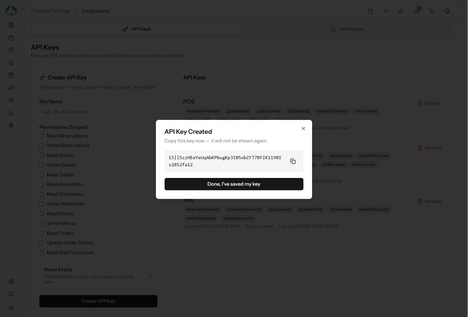 The API Keys page showing existing keys with their names and scopes, and a newly created key displayed once