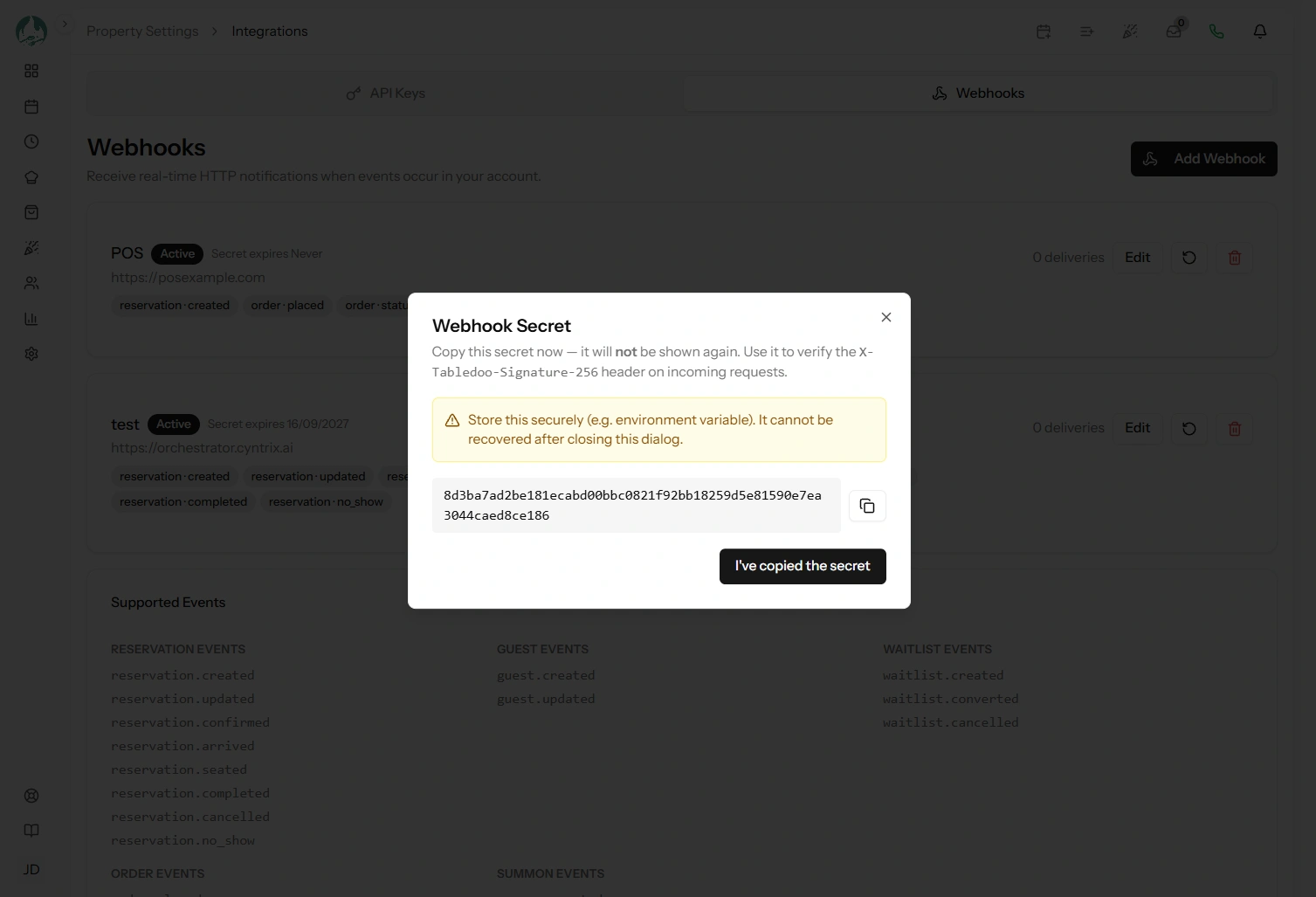 The Webhooks settings page listing endpoints with their URLs, subscribed events and active state
